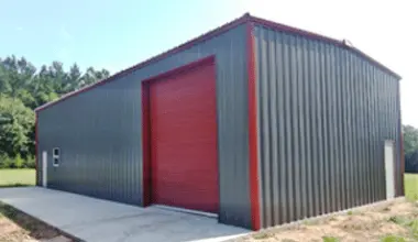 Steel Building By Walker Metals. A color red and dark gray Adco Steel Building constructed by Walker Metals