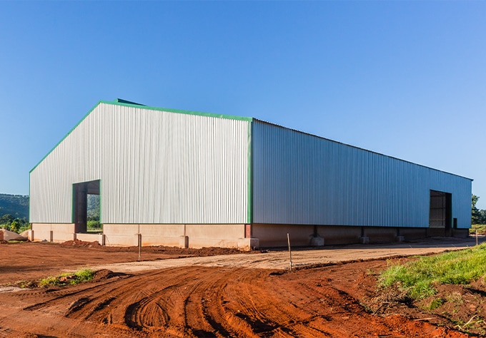 Metal buildings and roofing supplier in Livingston, LA Walker Metals. Image of new construction metal warehouse.