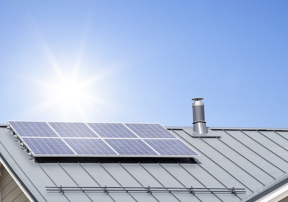 Metal roof with solar panels on top addressing the question Can You Put Solar Panels on a Metal Roof?